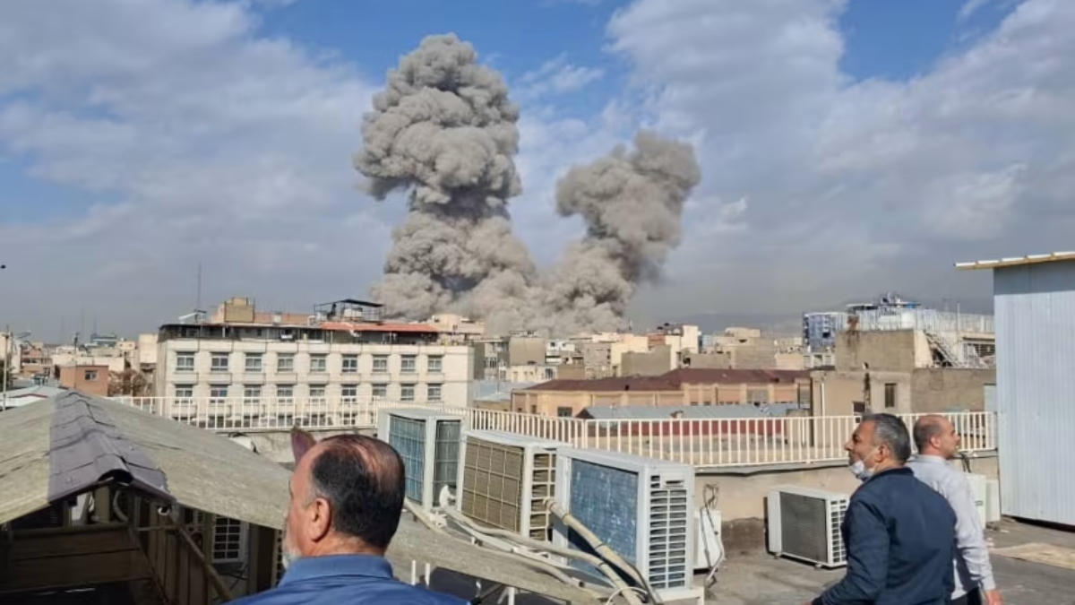 People-watch-as-smoke-rises-on-the-skyline-after-an-explosion-in-Tehran-Iran-28-February-2026