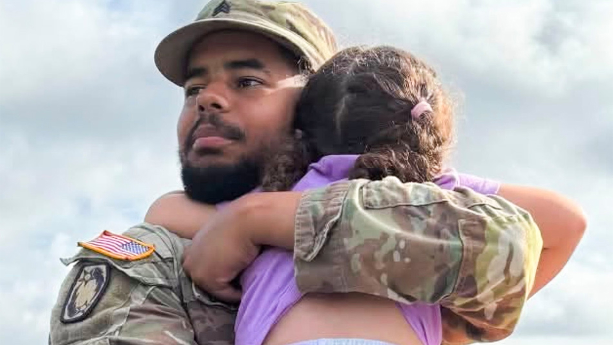 Sgt-Michael-Emmanuel-Swinton-with-his-daughter-21-07-2026
