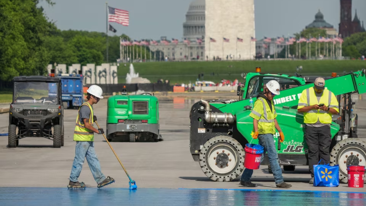 Workers renovate the blue-painted Lincoln Memorial Reflecting Pool in Washington