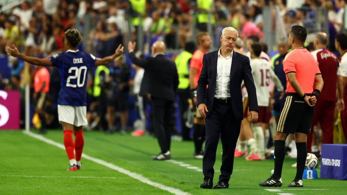 rance coach Didier Deschamps looks dejected as France's Desire Doue reacts during the match
